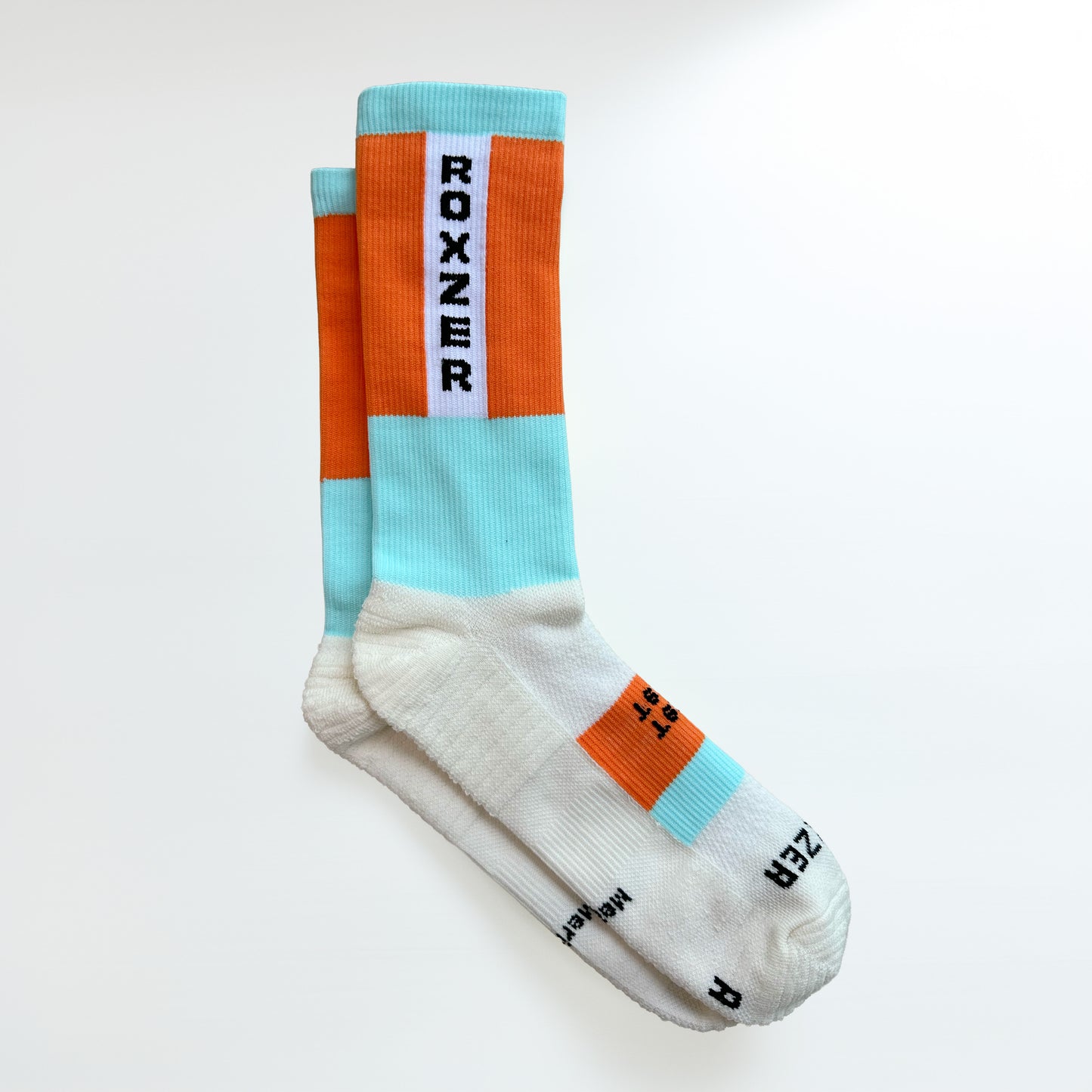 ROXZER Bold Block Merino HYROX performance sock, neon orange and blue, flatlay